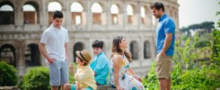 Family with a child during a natural-light photoshoot in a Rome park