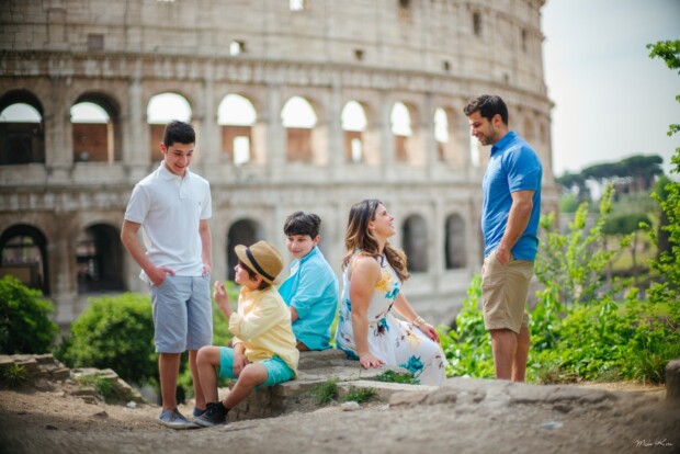 Family with a child during a natural-light photoshoot in a Rome park